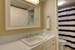 Guest bathroom with vanity, tub/shower, and lavatory